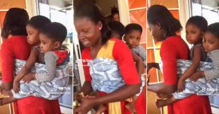 “I have never seen this before” – Reactions as sweet mother backs her 2 babies with 1 wrapper, impresses many (Watch video)