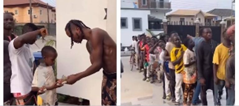 Naira Marley shares money to less privileged in his neighbourhood (Watch video)