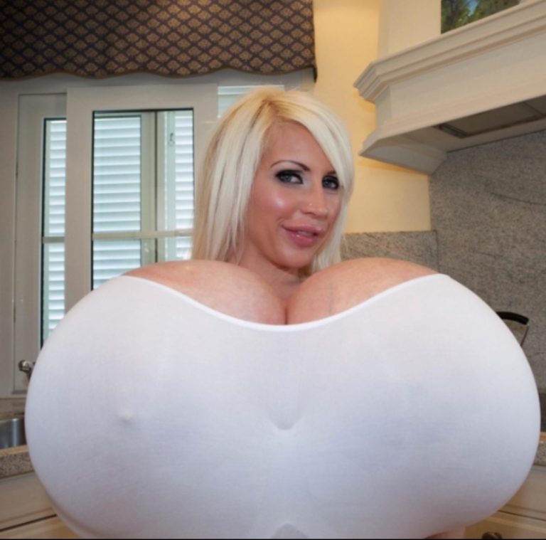 Woman with ‘biggest boobs in the universe’ says she wants more surgery even though it makes life difficult