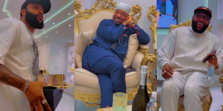 E-Money and Kcee host MC Oluomo in their mansion, gift him money, call him a ‘Powerful man’ (Video)
