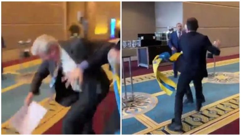 Watch as Ukrainian politician punches Russian representative for dragging his country’s flag from him at a conference in Turkey