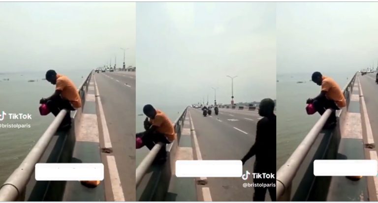 Watch moment man attempts jumping off bridge with traveling bag (Video)