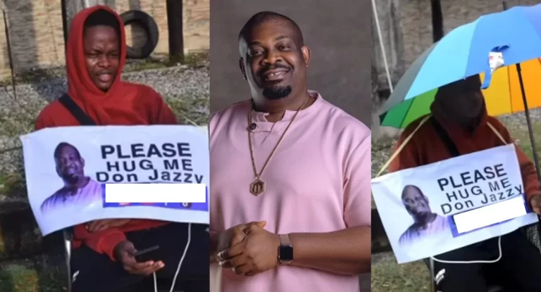 I won’t leave until he hugs me – Man holding placard waits in the rain for Don Jazzy (Video)