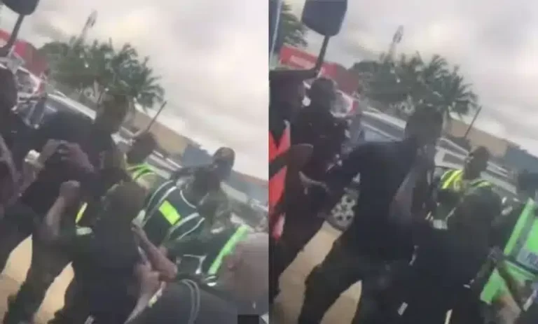 “He knack am gun for head” – Reactions as tall soldier and short policeman fight dirty in public (Video)