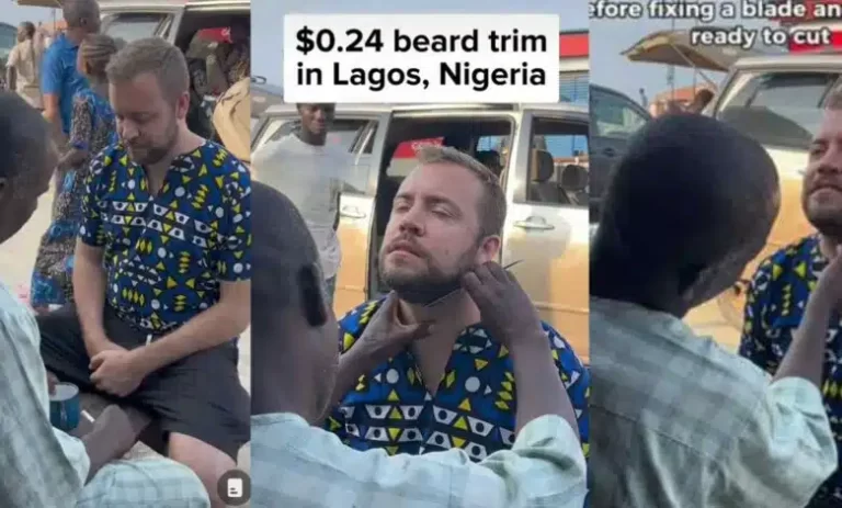 Foreigner who comes to Nigeria for holiday, heads to street to have clean shave with local barbers