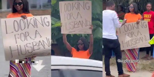 “Looking for a husband” – Social media users react as Lady displays placard, walks into street in search for life-partner (Video)