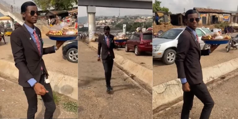 “Life na by packing” – Man rocks suit and tie as he hawks kola nuts, causes stir (Video)