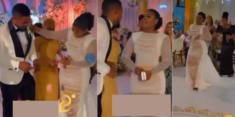 “She dress pass the bride” – Lady steals show at wedding as she rocks matching outfits with groom, rains money heavily on him (Video)
