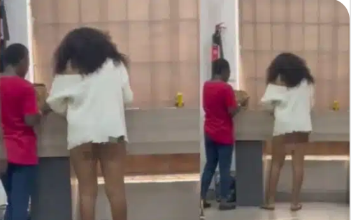 “See wetin person wear go bank, Nigeria don scatter” – Man laments over lady’s choice of outfit to a bank (Video)