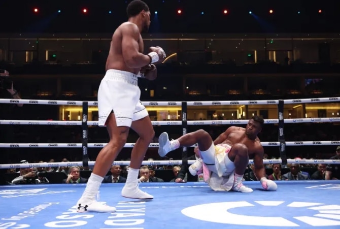 “Don’t leave boxing” – Joshua encourages Francis Ngannou following knockout loss (Video)
