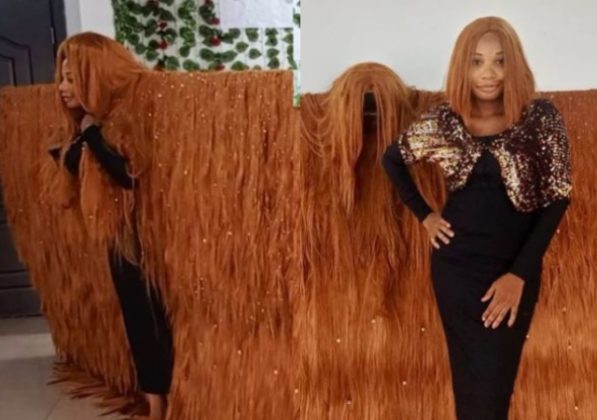 Nigerian lady makes history, sets Guinness World Record for the widest wig (Video)