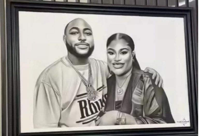 Nkechi Blessing takes her love for Davido to another level, makes frame of them in her bedroom