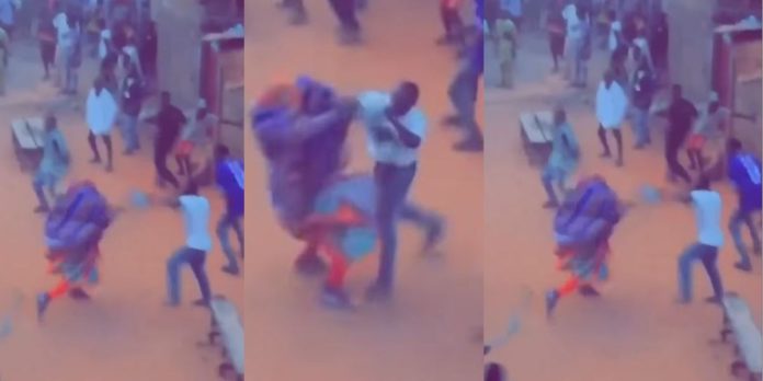 “The guy dey vex oh” – Video trends as man punches the living daylight out of a masquerade during an Egungun festival (Watch)